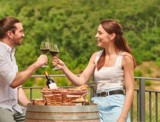 Couple enjpying a winery picnic in Bordeau vineyards